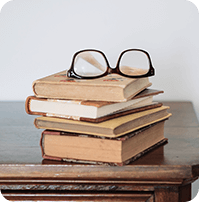 glasses-lying-pile-old-books